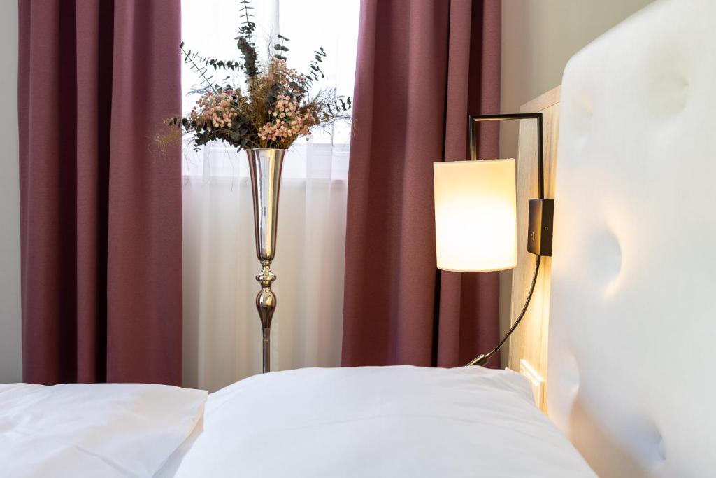 Postel nebo postele na pokoji v ubytování Boutiquehotel Bergvilla