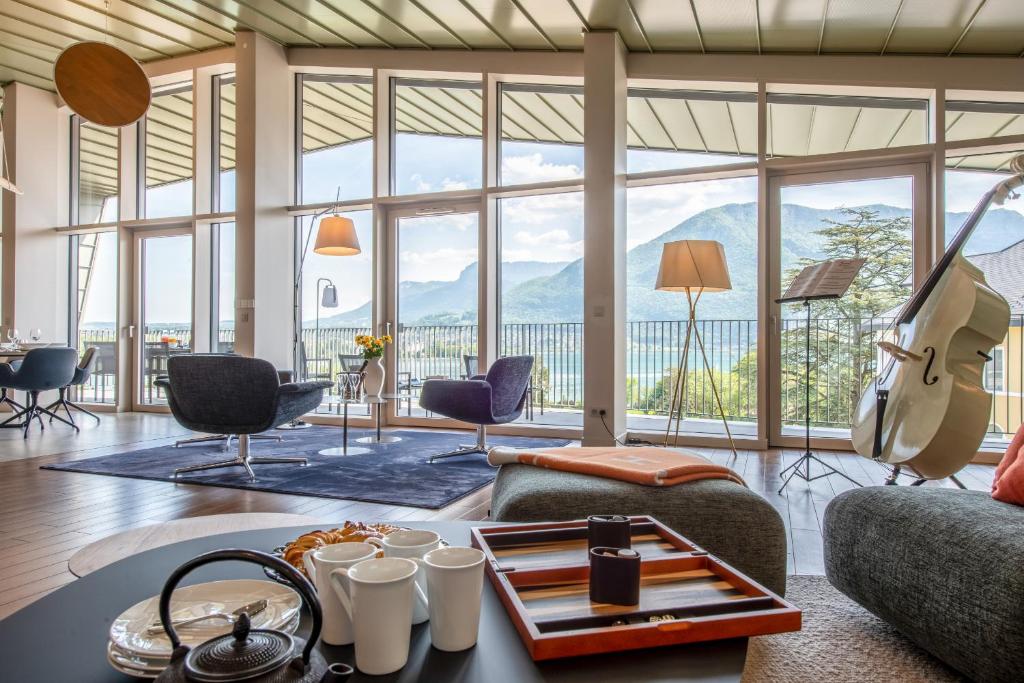 a living room with a view of the mountains at Le Tresorium in Annecy