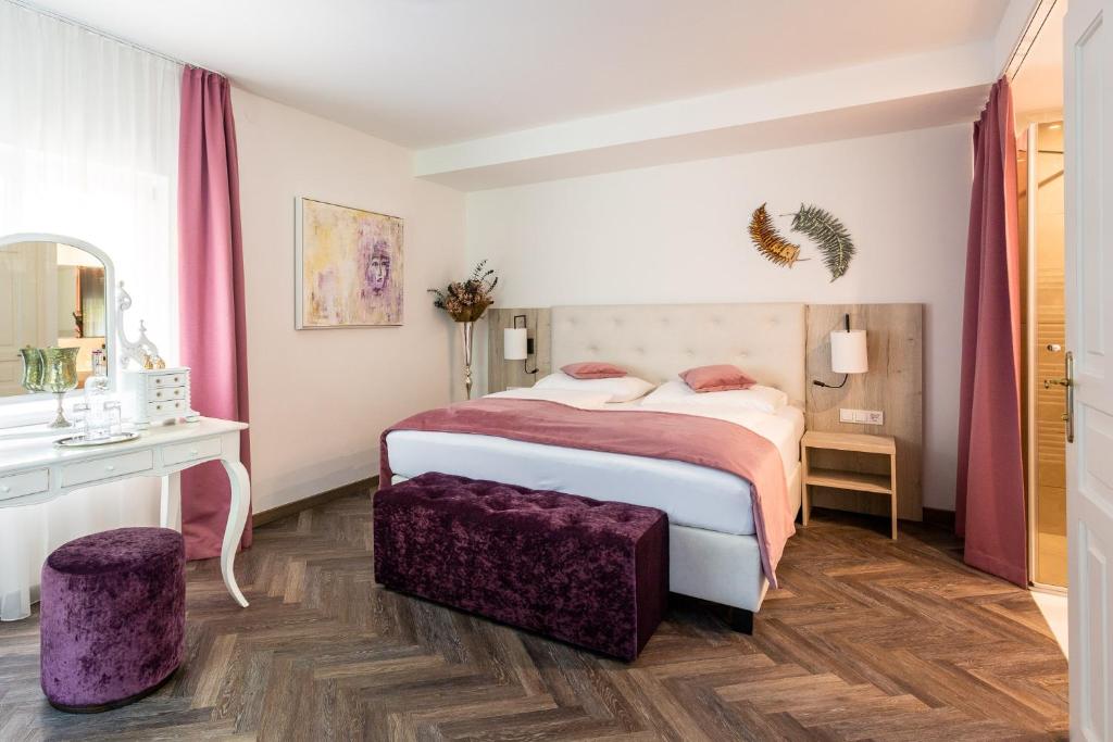 Postel nebo postele na pokoji v ubytování Boutiquehotel Bergvilla