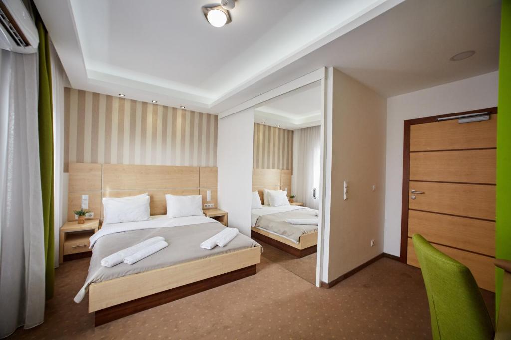 Postel nebo postele na pokoji v ubytování Laurus Motel Airport Tuzla