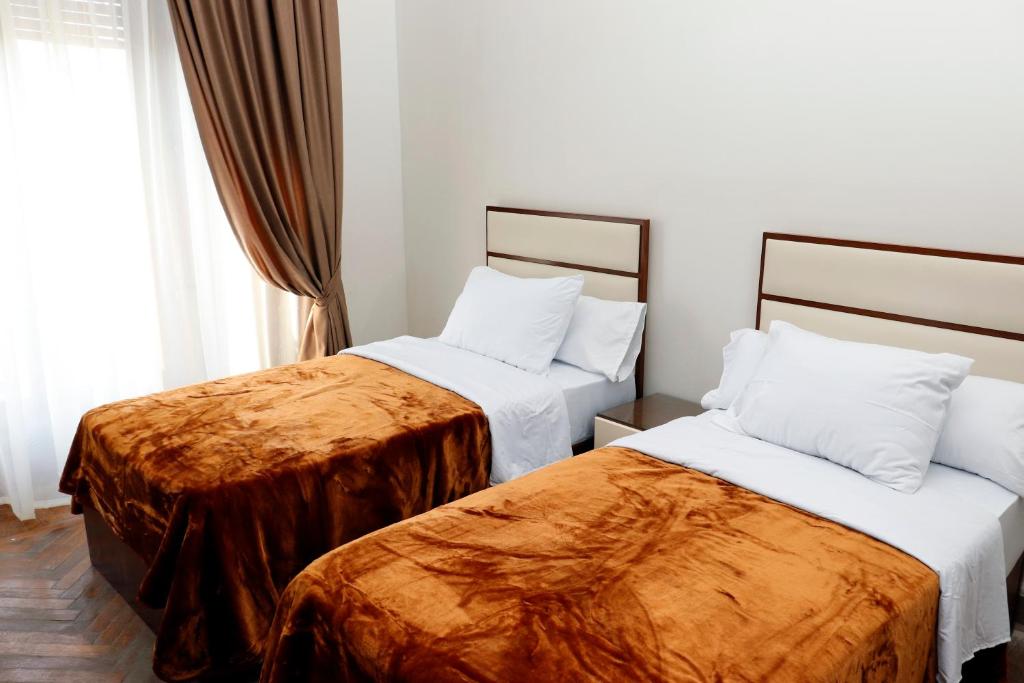 Postel nebo postele na pokoji v ubytování Ismailia House Inn