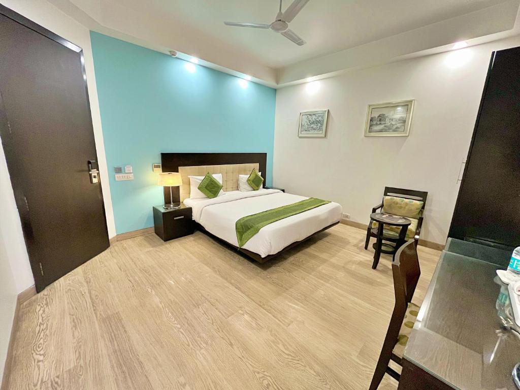 Postel nebo postele na pokoji v ubytování Amber Inn by Orion Hotels