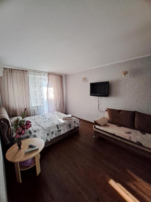 Postel nebo postele na pokoji v ubytování однокомнатная квартира в сердце города