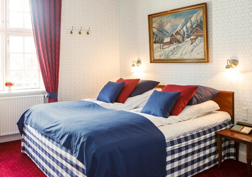 Postel nebo postele na pokoji v ubytování Hotel Kirstine