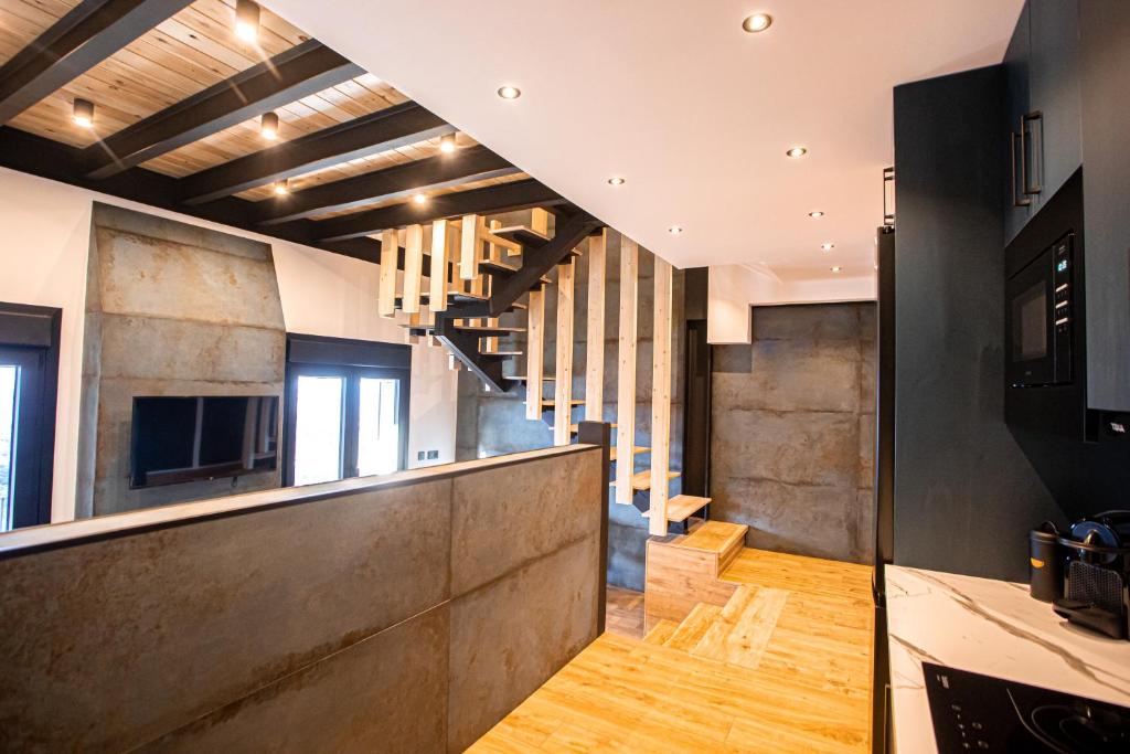 Televízia a/alebo spoločenská miestnosť v ubytovaní APARTAMENTO BLOSSOM