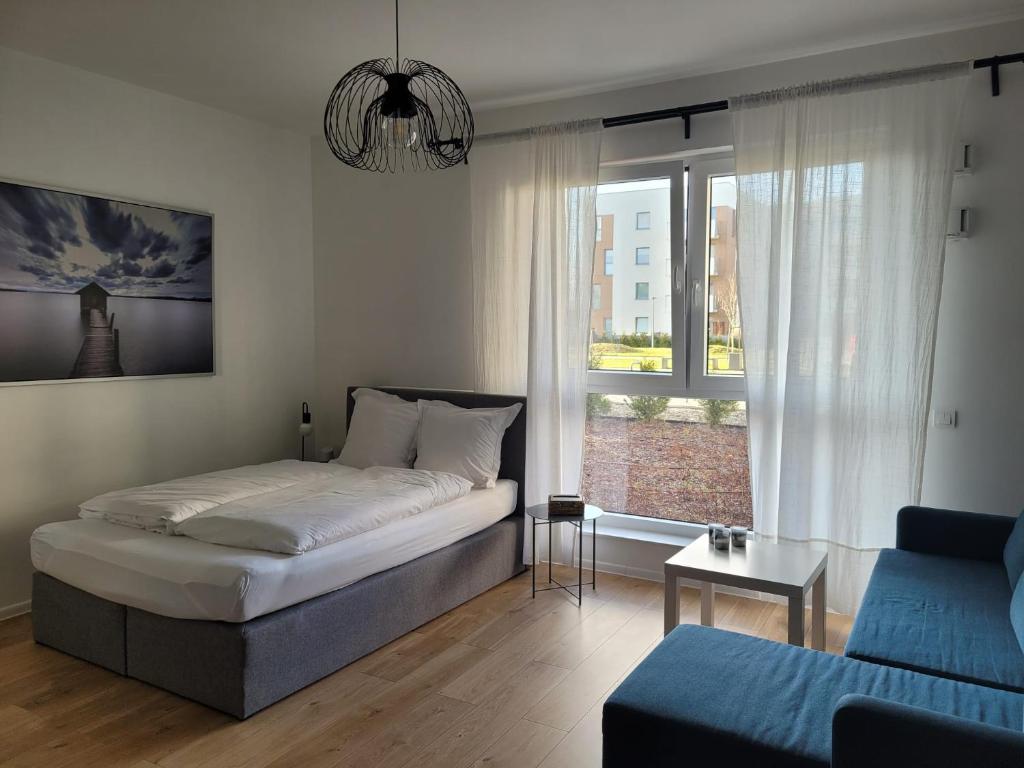 Posteľ alebo postele v izbe v ubytovaní 16 Apartamenty Ptak Szpital Matki Polki Szpital Kopernika Mandoria Orientarium Atlas Arena Plac Zabaw - Zamojska 20a m16 Parking