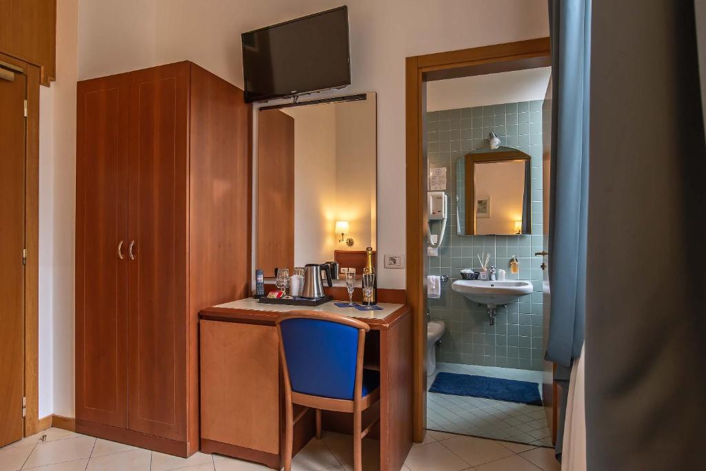 Postel nebo postele na pokoji v ubytování Hotel Bonifacio