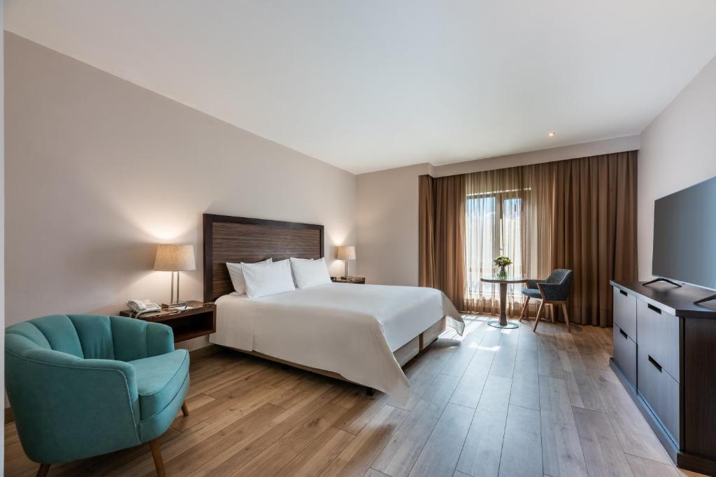 Postel nebo postele na pokoji v ubytování Hotel Morrison Zona Rosa
