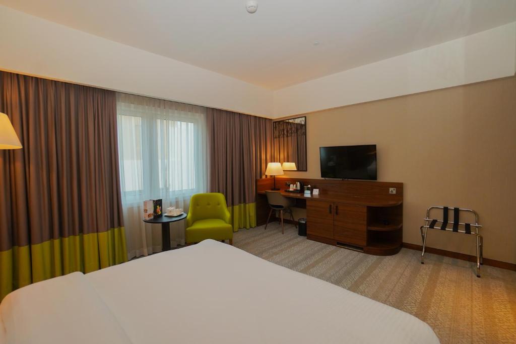 TV a/nebo společenská místnost v ubytování The Grand Lux Hotel