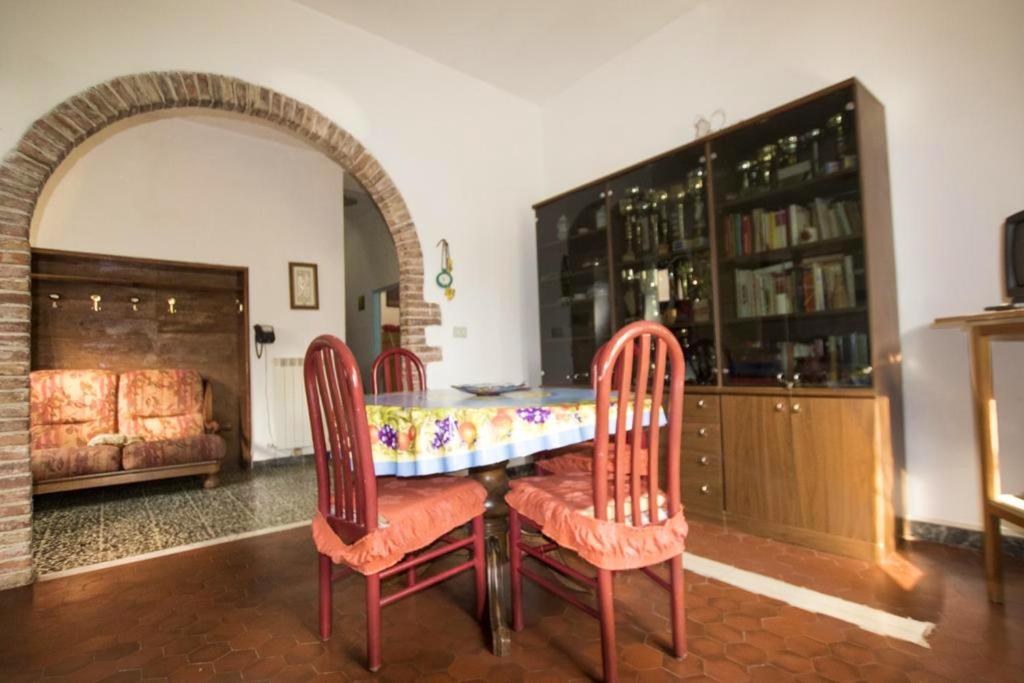a dining room with a table and two chairs at 2 bedrooms apartement with shared pool and wifi at Massa Marittima in Massa Marittima