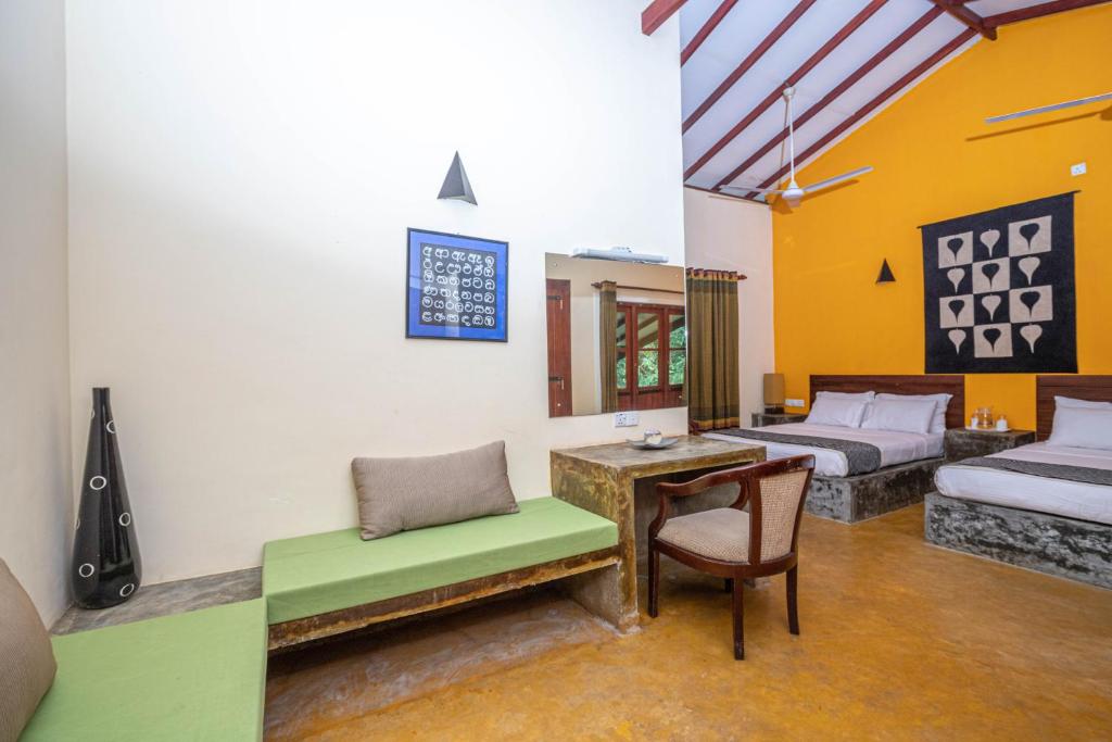 Postel nebo postele na pokoji v ubytování Kuru Ganga Villa