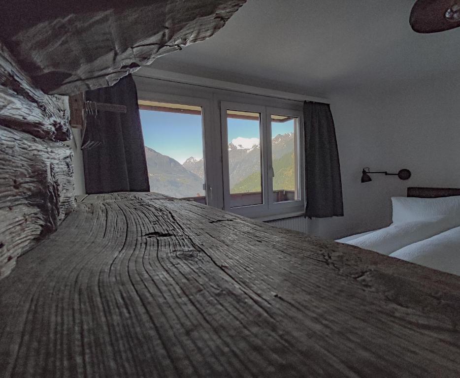Postel nebo postele na pokoji v ubytování Berghotel Weisshorn