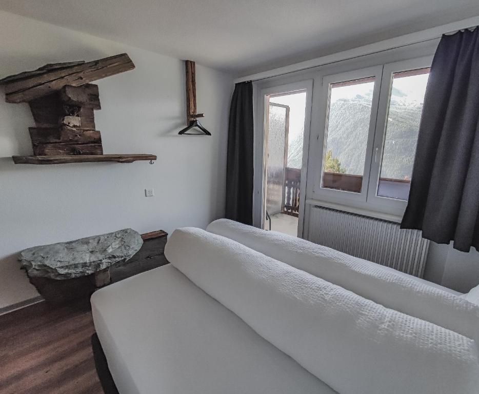 Postel nebo postele na pokoji v ubytování Berghotel Weisshorn