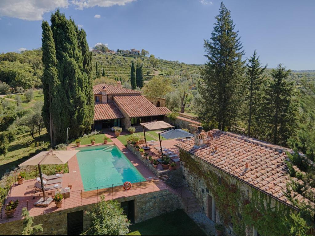 an aerial view of a house with a swimming pool at Villa La Casina in Castellina in Chianti