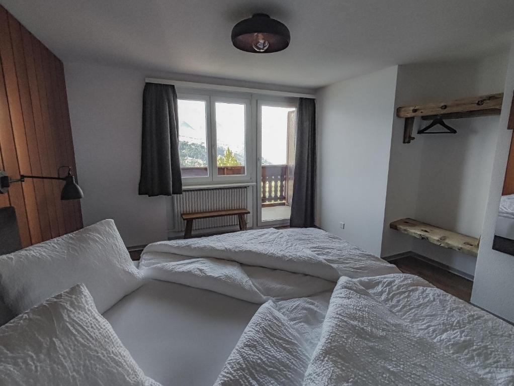 Postel nebo postele na pokoji v ubytování Berghotel Weisshorn