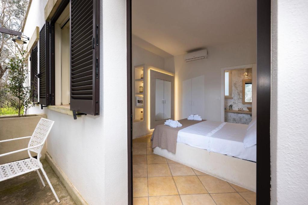 A bed or beds in a room at Tenuta Sidore
