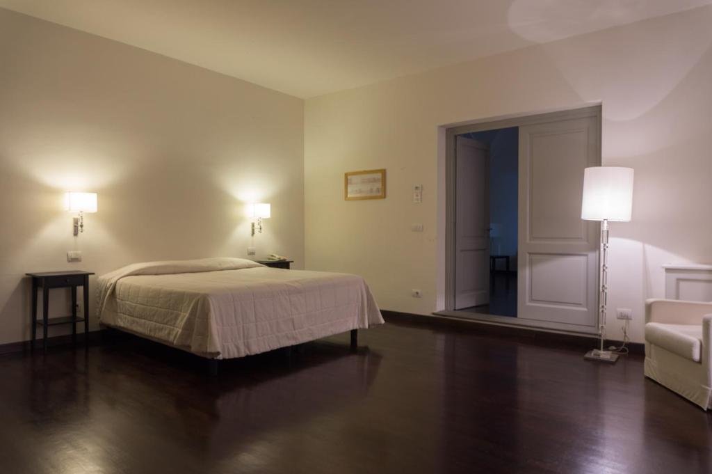 Posteľ alebo postele v izbe v ubytovaní Relais Villa Il Palagio