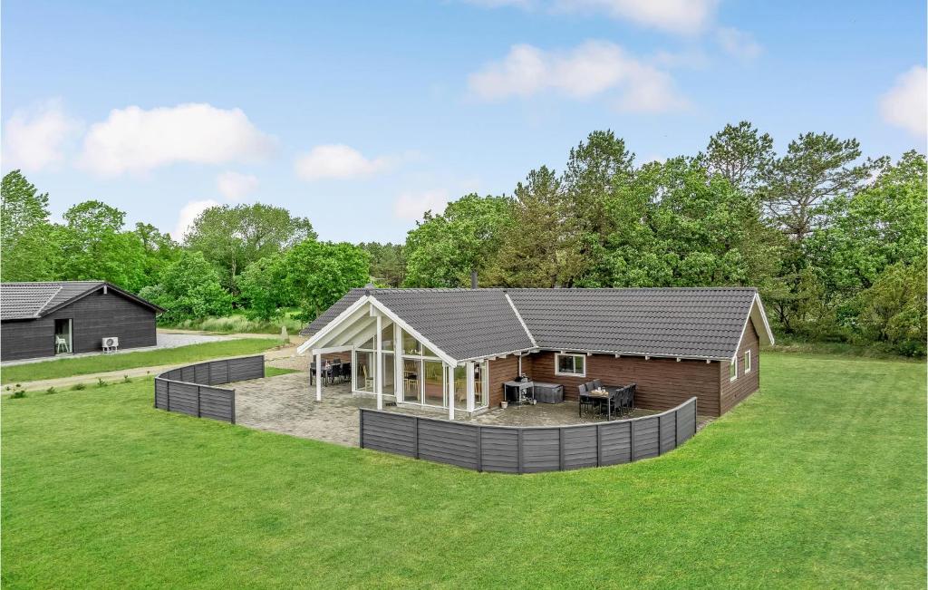 a home with a large yard with a house at Stunning Home In Rm With Kitchen in Rømø Kirkeby