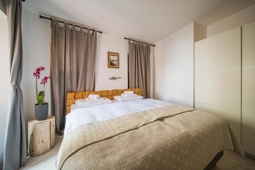 Postel nebo postele na pokoji v ubytování Villa Borgo B&B
