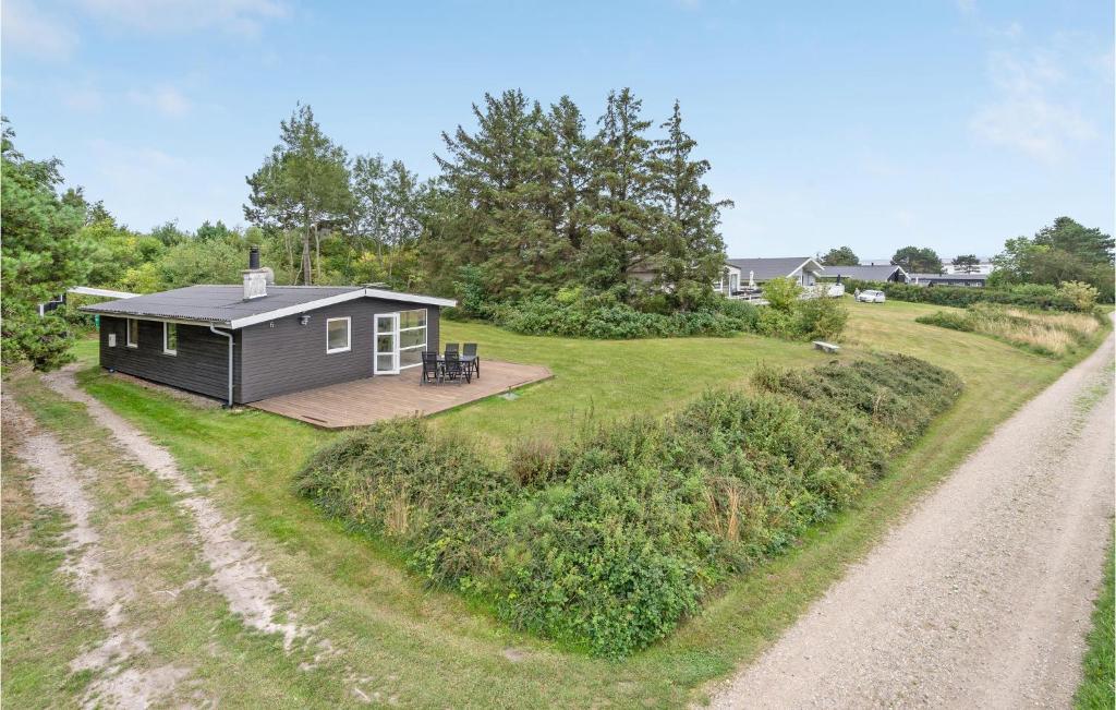a tiny house on the side of a dirt road at Amazing Home In Ebeltoft With 2 Bedrooms And Wifi in Ebeltoft