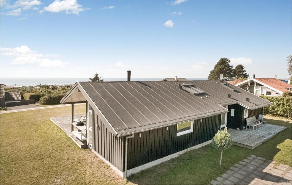 an exterior view of a house with a metal roof at Amazing Home In Slagelse With 3 Bedrooms And Wifi in Drøsselbjerg