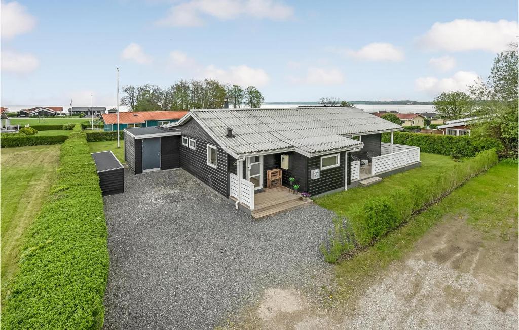 an aerial view of a tiny house in a yard at Amazing Home In Juelsminde With Kitchen in Sønderby