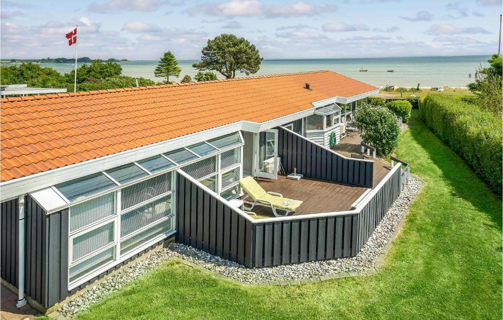 an overhead view of a house with an orange roof at Amazing Home In Bjert With House Sea View in Binderup Strand