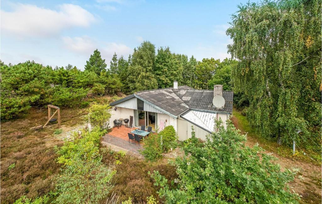 an aerial view of a house in the woods at Four-Bedroom Holiday Home In Romo in Tagholm