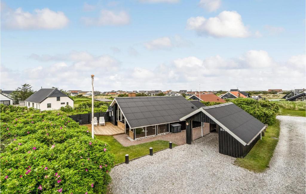 an aerial view of a house with a black roof at 3 Bedroom Nice Home In Thisted in Nørre Vorupør