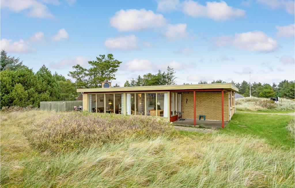 a house on top of a grassy field at Lovely Home In Thisted With House A Panoramic View in Thisted