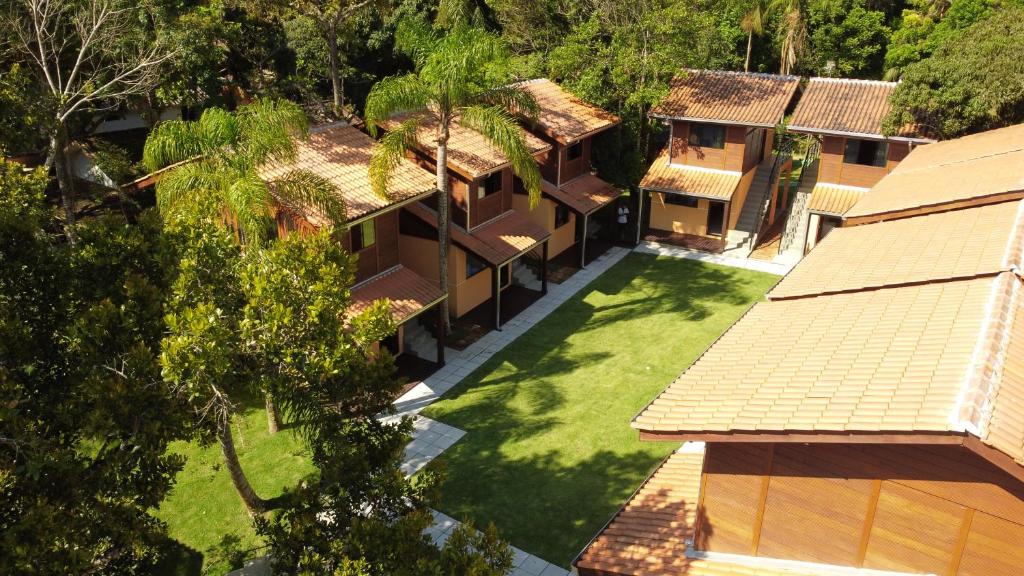 an aerial view of a house with a yard at Pousada Villa Encantada Ilha do Mel in Ilha do Mel