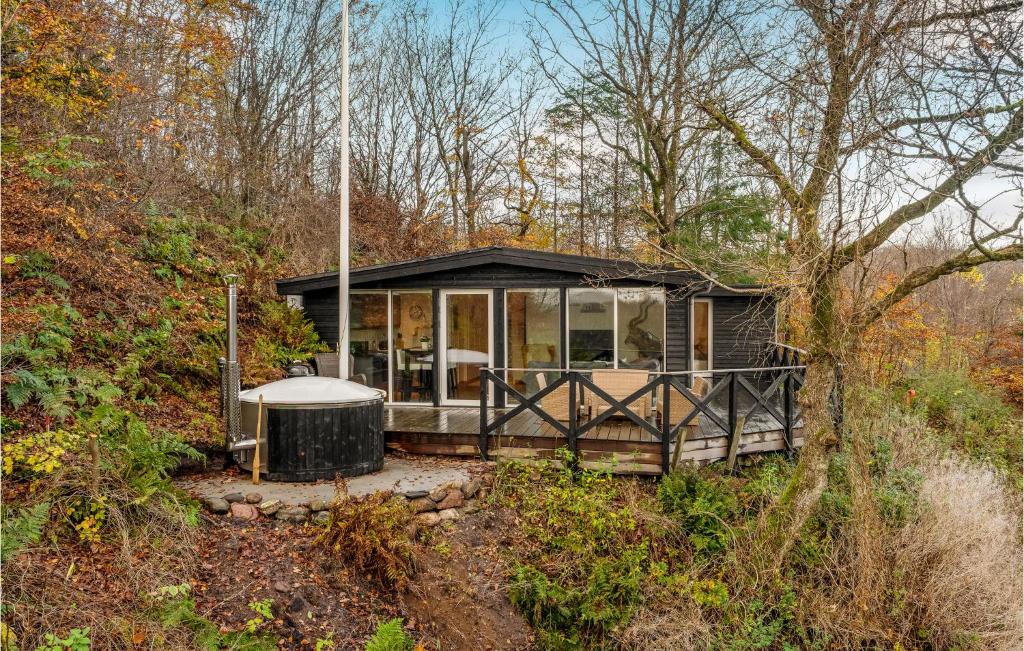 a house in the middle of a forest at Gorgeous Home In Gistrup With Sauna in Gistrup