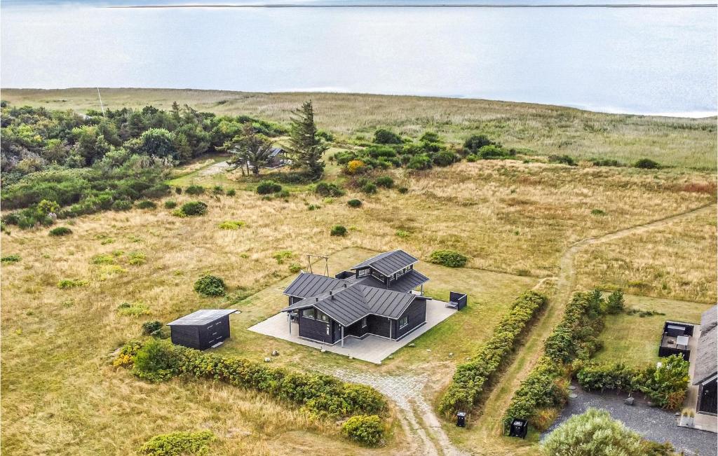 an overhead view of a house in a field at Holiday Home Brombærvej Skjern Xii in Lem