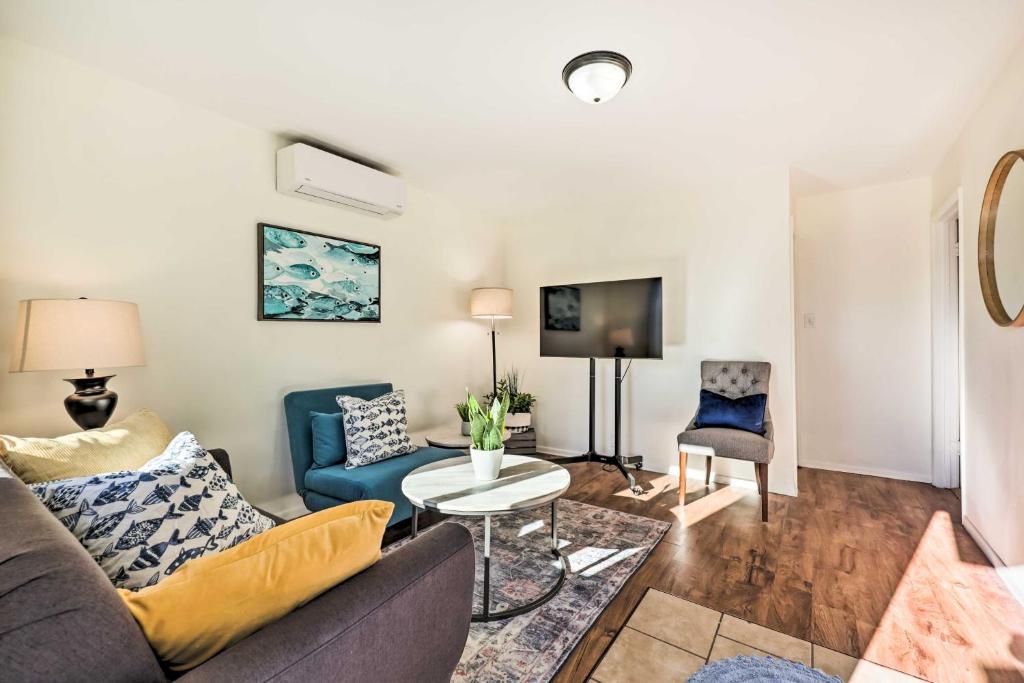 a living room with a couch and a table at Quiet Carpinteria Cottage By Town and Beaches in Carpinteria