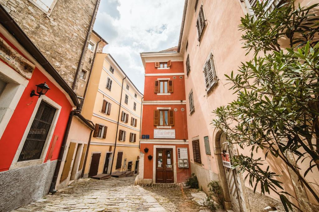 an alley in an old town with buildings at Villa Borgo B&B in Motovun