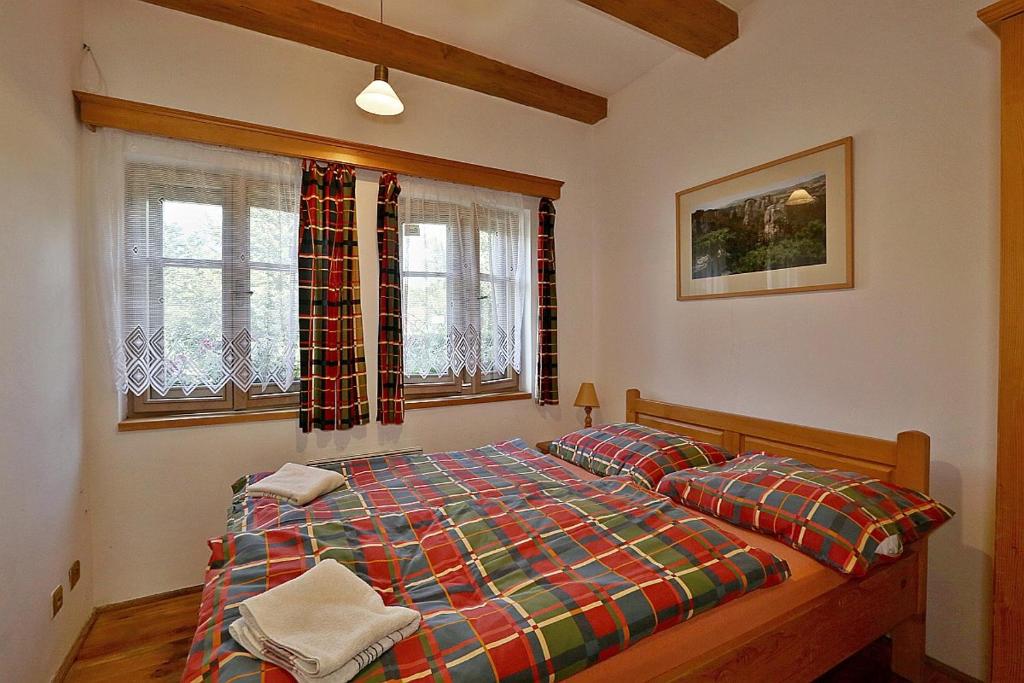 Postel nebo postele na pokoji v ubytování Miniresort AMULET
