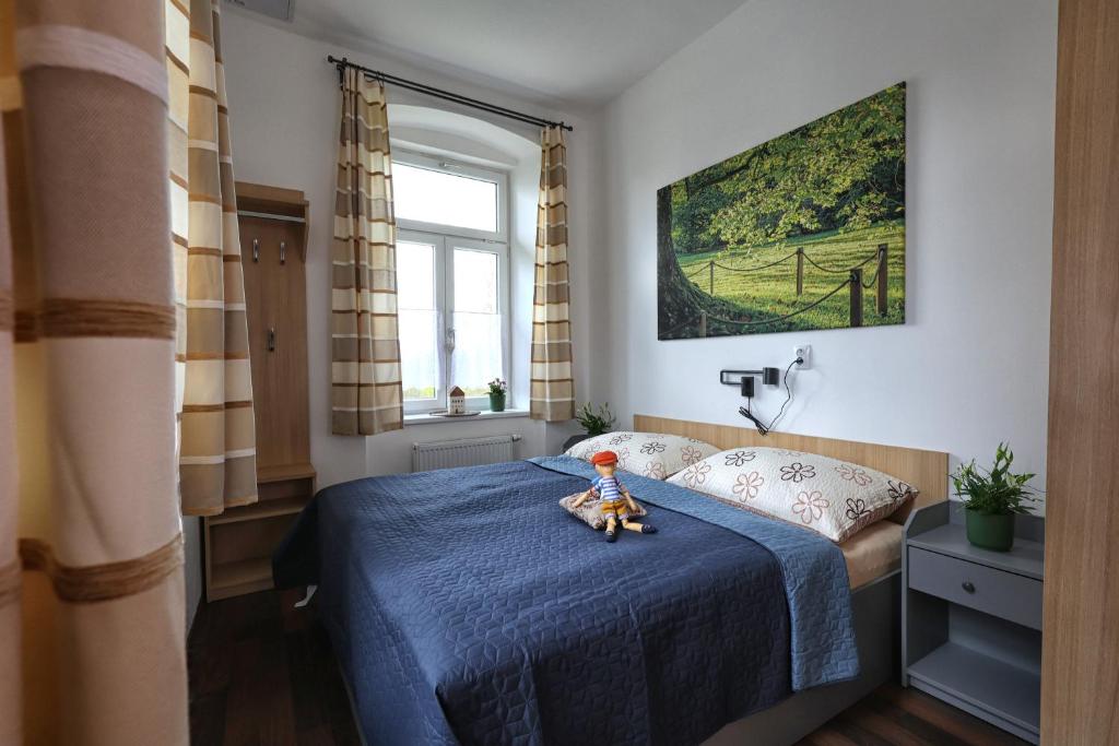 Postel nebo postele na pokoji v ubytování Apartmány U Aloise