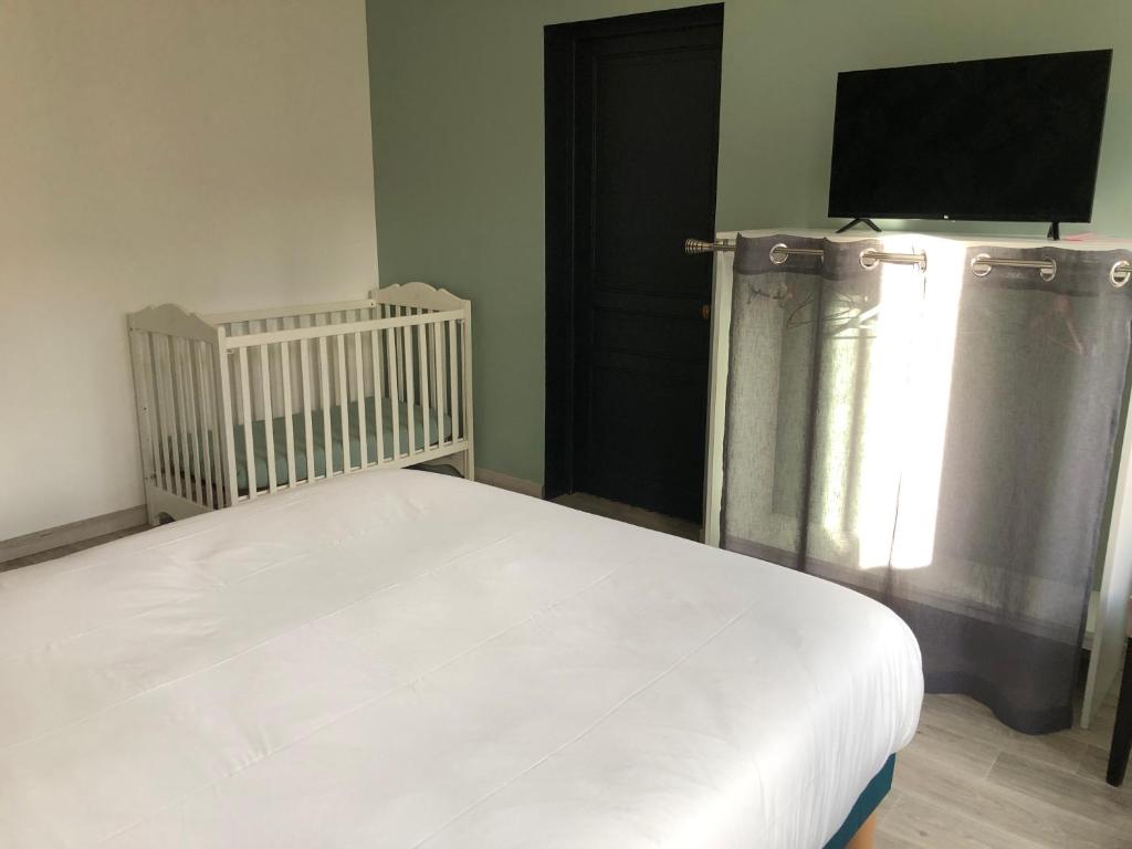 Postel nebo postele na pokoji v ubytování Aux Portes des Lacs