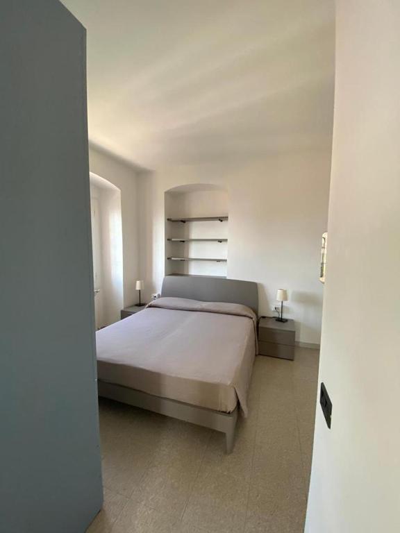 Łóżko lub łóżka w pokoju w obiekcie Residence Riviera