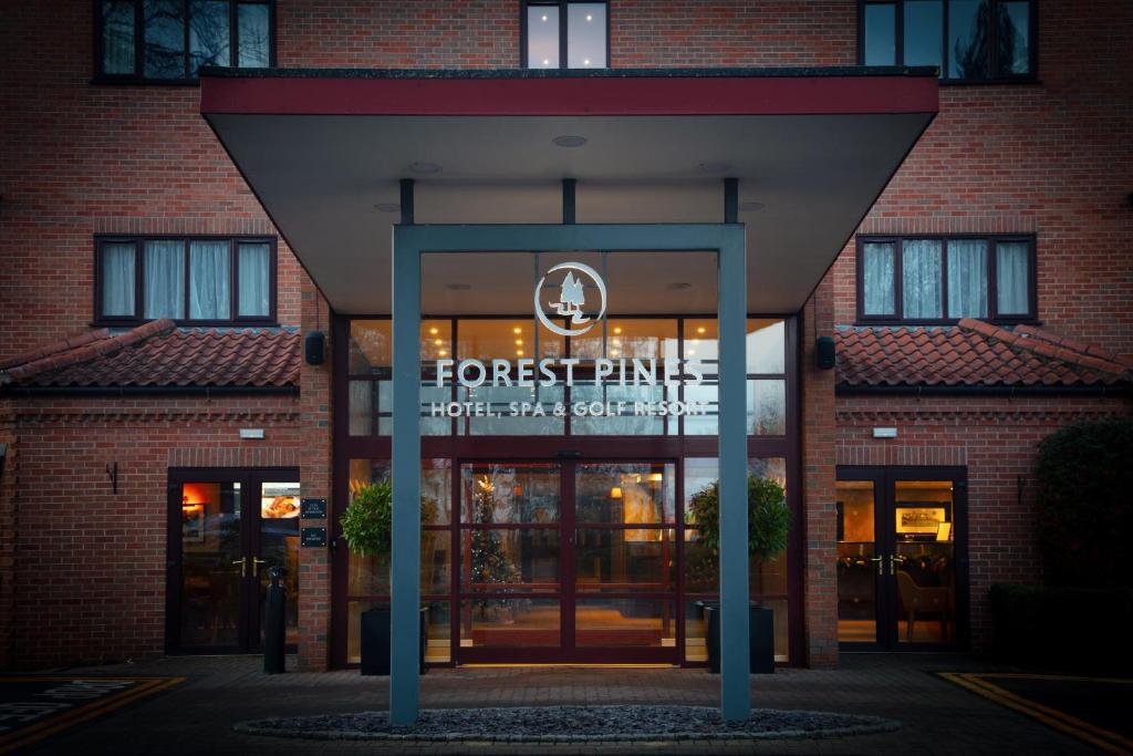 a front entrance to a hotel with a sign on it at Forest Pines Hotel, Spa & Golf Resort in Brigg