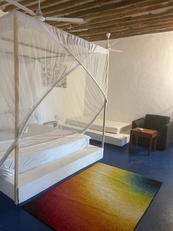 Postel nebo postele na pokoji v ubytování Babalao Rooftop Hotel