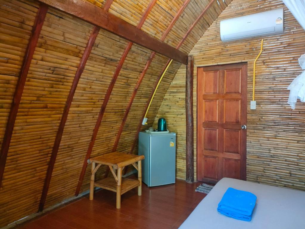 Postel nebo postele na pokoji v ubytování Baanmaiphai Resort