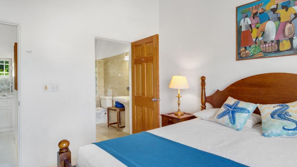Postel nebo postele na pokoji v ubytování Shoal Bay Villas