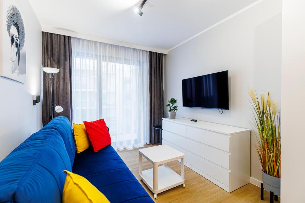TV a/nebo společenská místnost v ubytování Balticus Apartamenty Standard Promenada Gwiazd 14