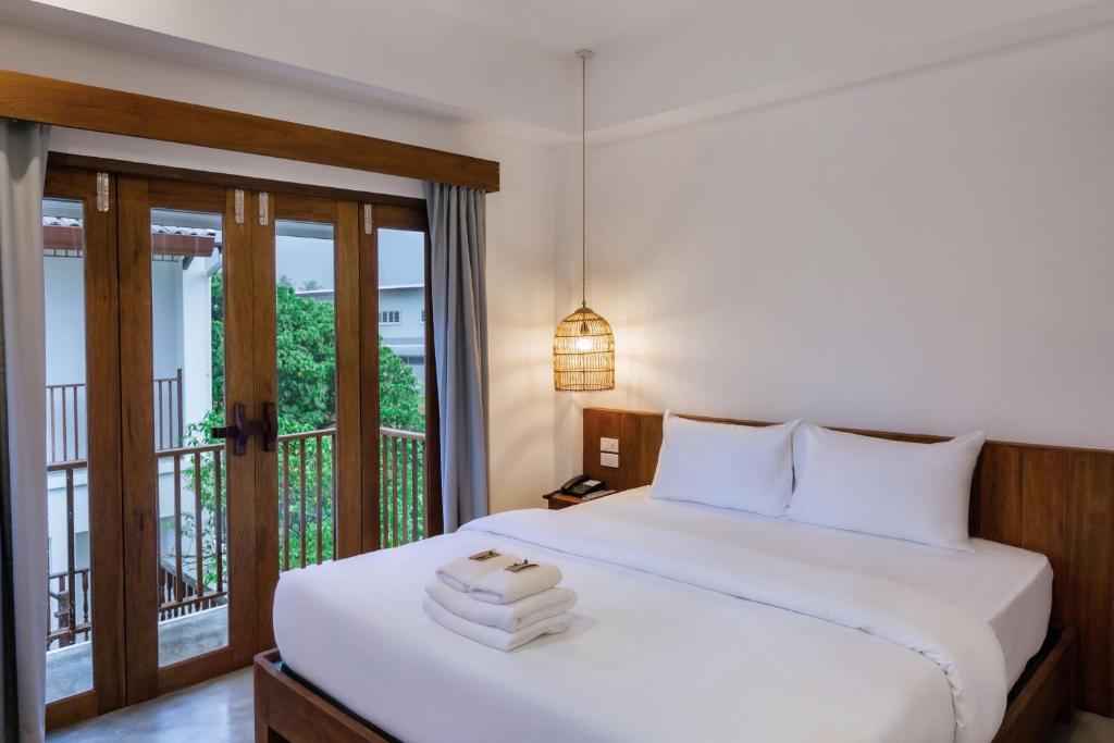 Postel nebo postele na pokoji v ubytování Phang Nga Origin Hotel
