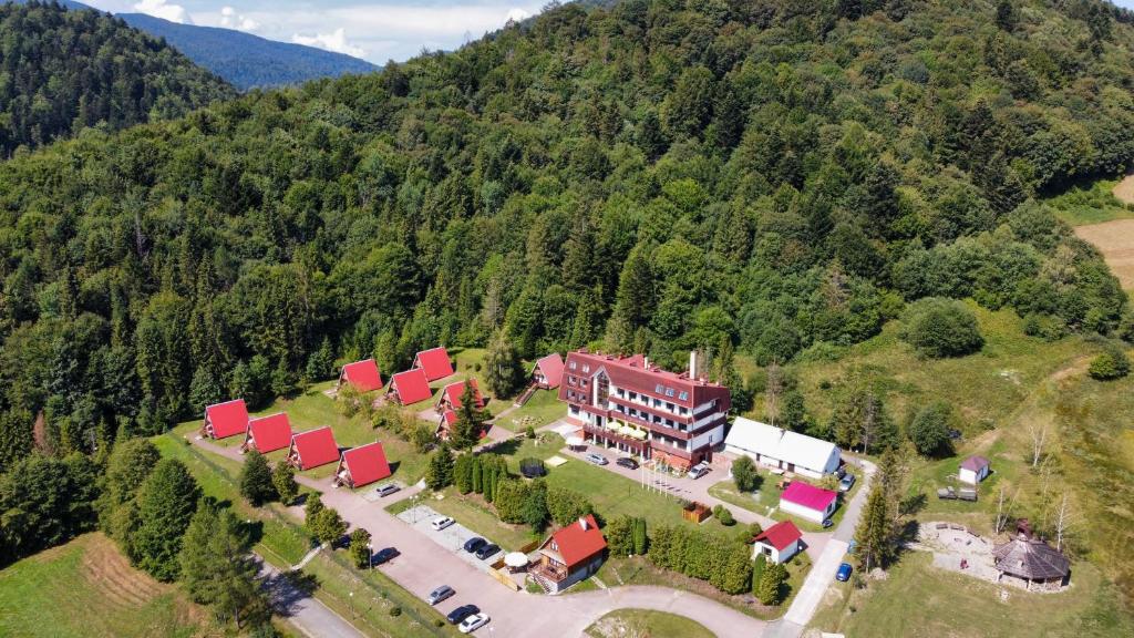 an aerial view of a large building with red roofs at Perełka Bieszczady in Cisna
