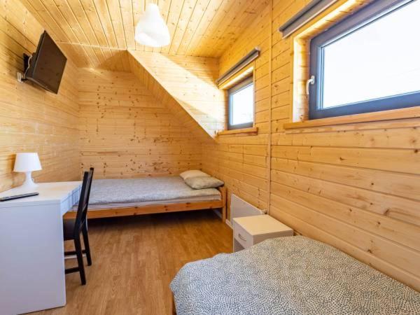 Posteľ alebo postele v izbe v ubytovaní OSADA JANTAr 3 DOM 70m2