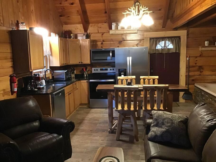 a kitchen with a table and a kitchen with a dining room at Dollywood! Brand new Dancing Bear 3-Bear Tracks in Pigeon Forge
