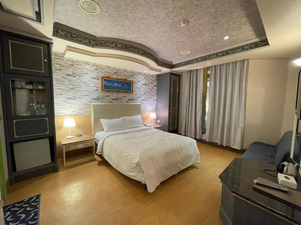 Postel nebo postele na pokoji v ubytování Wenpin Hotel - Pier 2