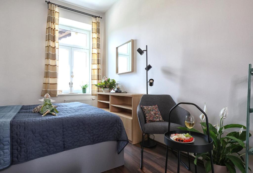 Postel nebo postele na pokoji v ubytování Apartmány U Aloise